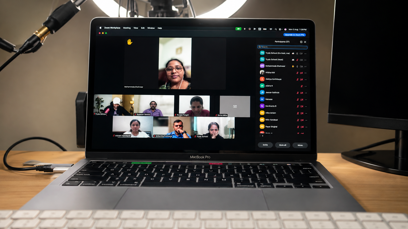 A live Trydo School community session running on a laptop in a studio setup